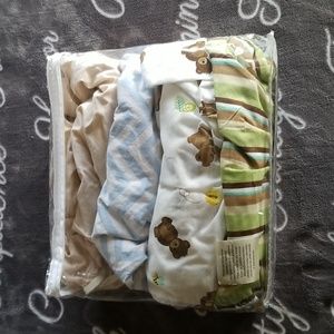 Bundle lot of crib sheets and a dust ruffle EUC